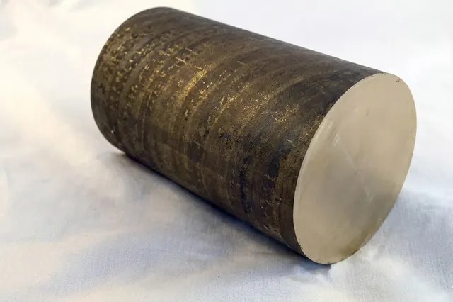 Large-diameter bronze round bar showing the end face