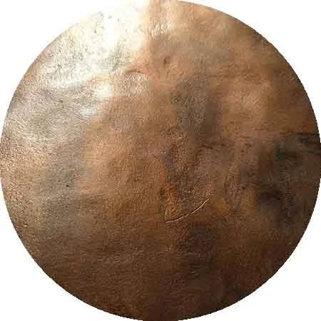 Round bronze plate blank with a natural surface