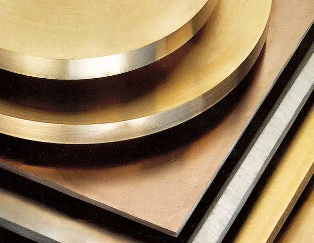 Bronze plates and circular discs showing machined edges